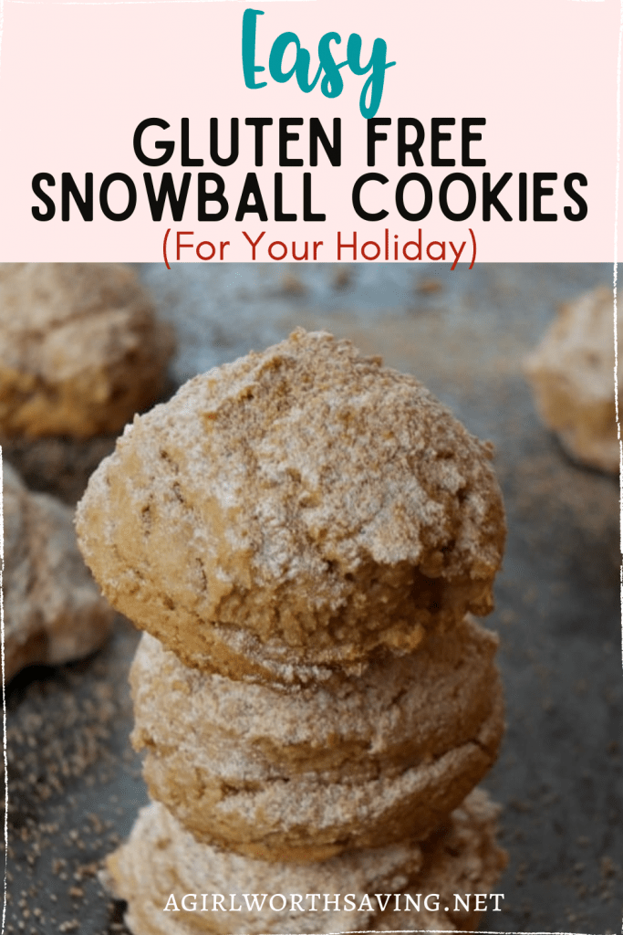 gluten free snowball cookies stacked on a baking sheet with text overlay on top