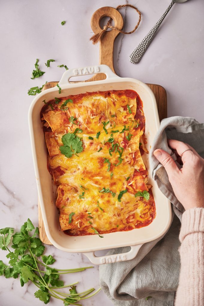 Gluten Free Enchiladas That Will Blow Your Taste Buds Away Kelly Bejelly Gluten free Enchiladas are a Mexican dish that is made with corn tortillas, corn or tomato sauce, cheese, and other toppings. The word “enchilada” literally means “to chili (hot pepper) something” in Spanish.