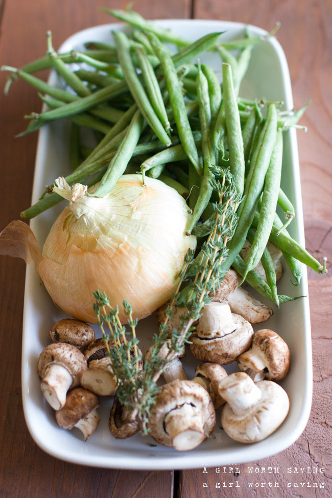 Gluten-free Green Bean Casserole Kelly Bejelly fresh onions, mushrooms, green beans and thyme on a plate to show ingredients for this gluten free green bean casserole