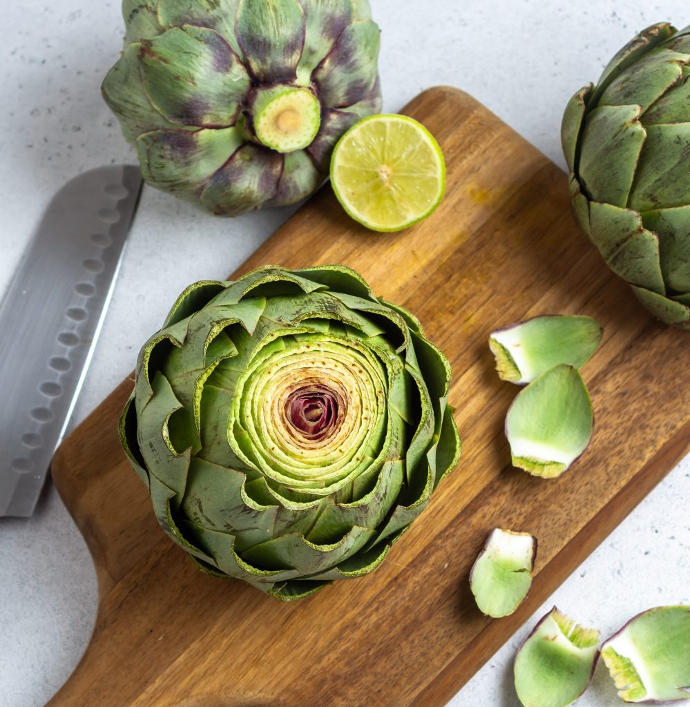 Instant Pot Artichokes Kelly Bejelly cut artichokes on a cutting board