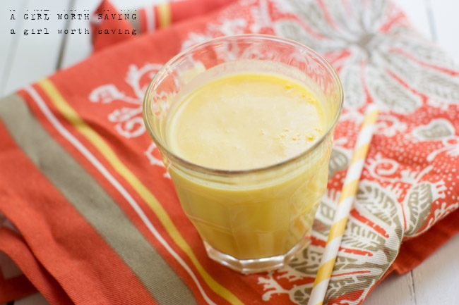 Peach Smoothie Kelly Bejelly Peach Smoothie in a glass with a straw to the side