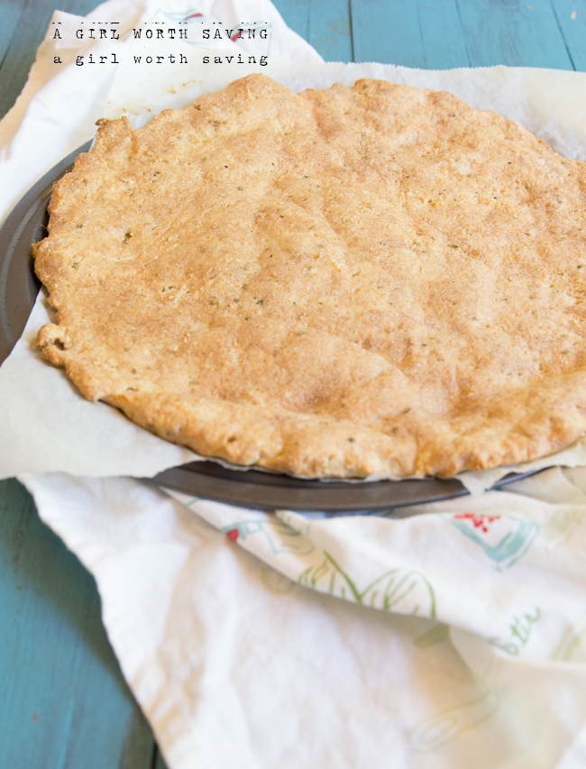 Pre-baked keto pizza crust on  a counter top