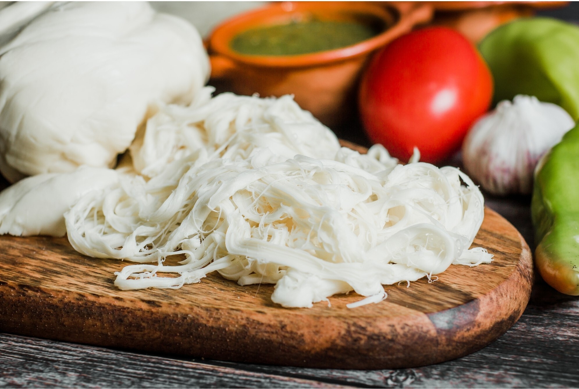 oaxaca cheese freshly made on a cutting board