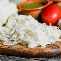 oaxaca cheese freshly made on a cutting board