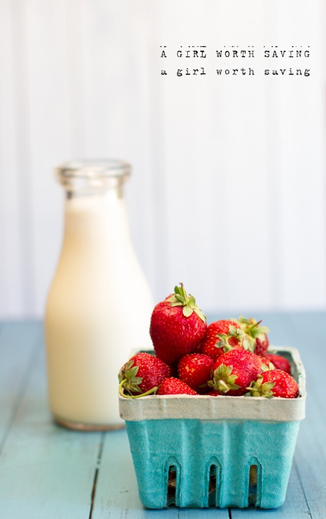Fresh milk and fresh strawberries on a table to make homemade Strawberry Milk