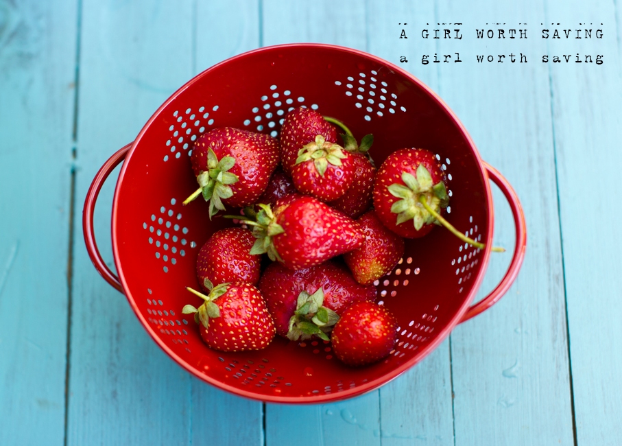fresh strawberries in a strainer for this Strawberry Milk recipe