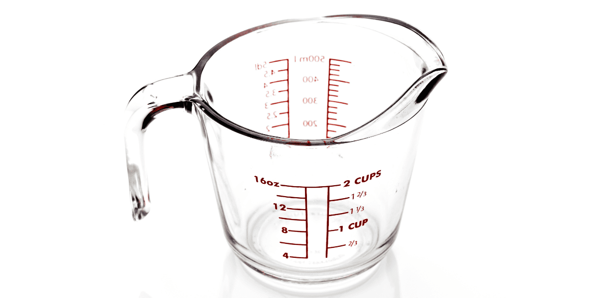 how many ounces in a cup text overlay with measuring cup in the background