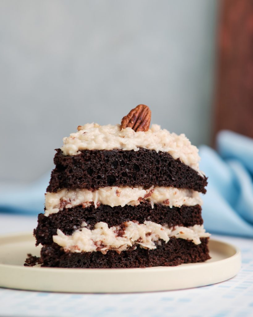 Sliced German Chocolate cake showing the frosting