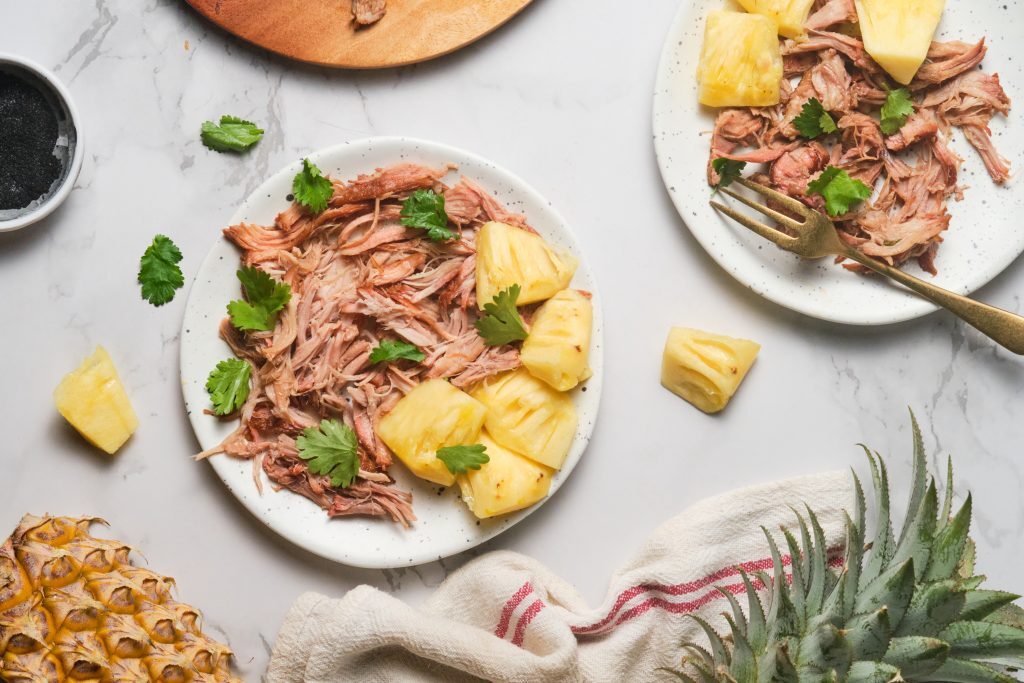 Kalua pork plated with diced fresh pineapple