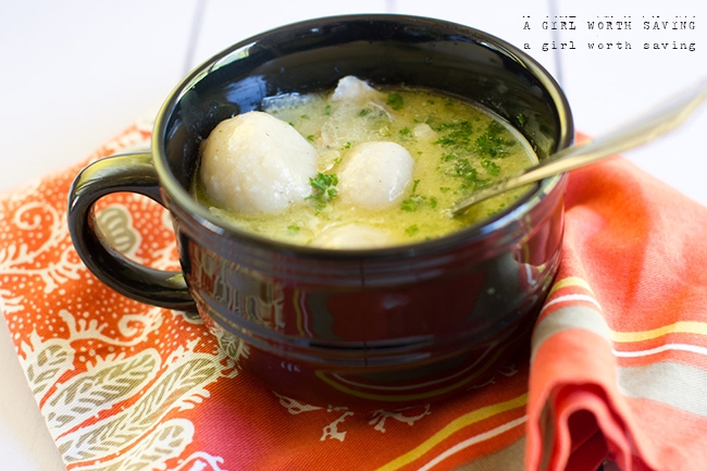 paleo chicken and dumplings in a mug with a spoon inside