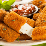 Best Gluten free Mozzarella Sticks that Everyone Will Love Kelly Bejelly homemade gluten free mozzarella sticks with cheese oozing out