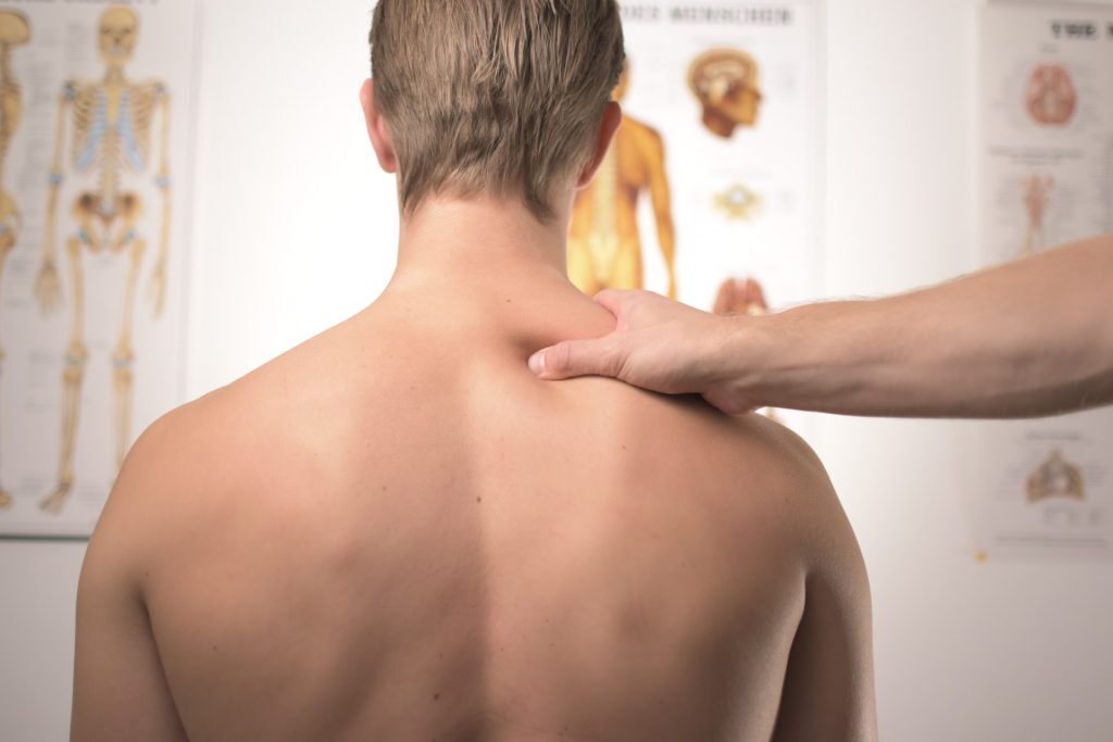 How A Balanced Diet and Chiropractic Care Can Help Kelly Bejelly man receiving chiropractic care