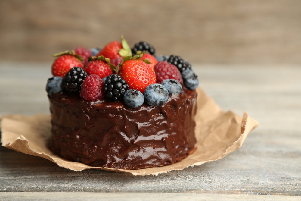 Recipe Index Kelly Bejelly Tasty paleo chocolate cake with different berries on wooden table