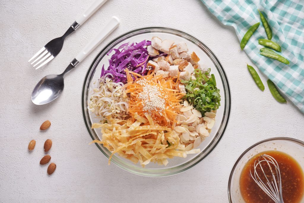 Chinese Chicken Salad Kelly Bejelly Mixing together the ingredients for this Chinese chicken salad recipe
