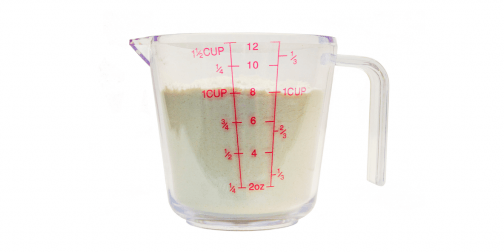 How Many Ounces in a Cup? Kelly Bejelly measuring cup with dry ingredients inside