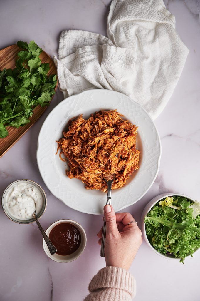 Finger Licking Crockpot bbq chicken Kelly Bejelly Bowl filled with shredded crockpot bbq chicken