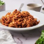 Finger Licking Crockpot bbq chicken Kelly Bejelly bowl filled with shredded crockpot bbq chicken