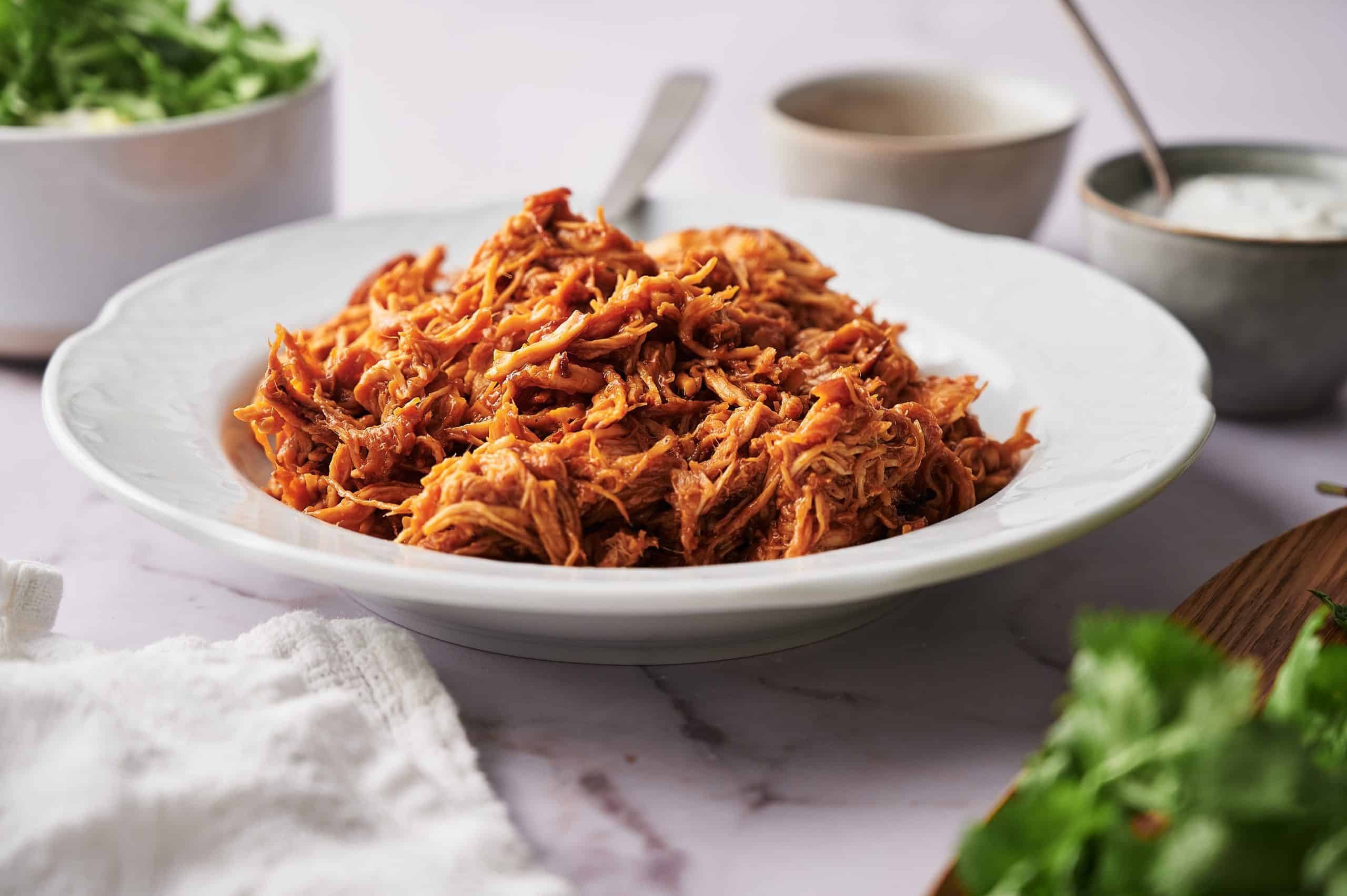 Recipe Index Kelly Bejelly bowl filled with shredded crockpot bbq chicken
