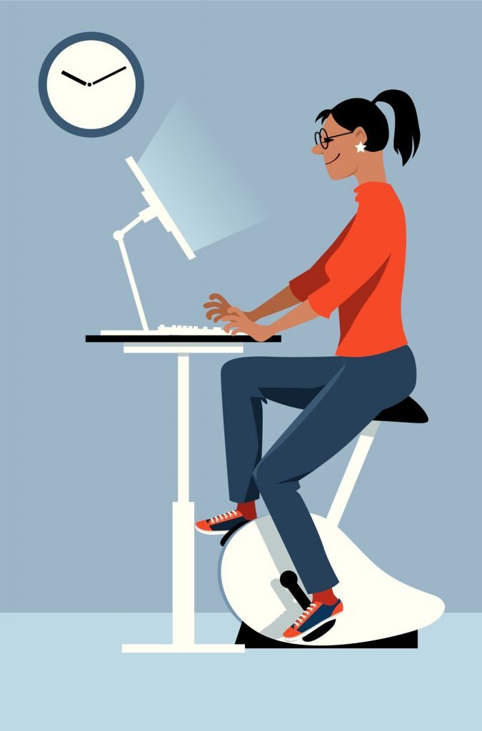 Under Desk Bike vs Elliptical: Which is Better? Kelly Bejelly Woman at work on an under desk bike vs elliptical