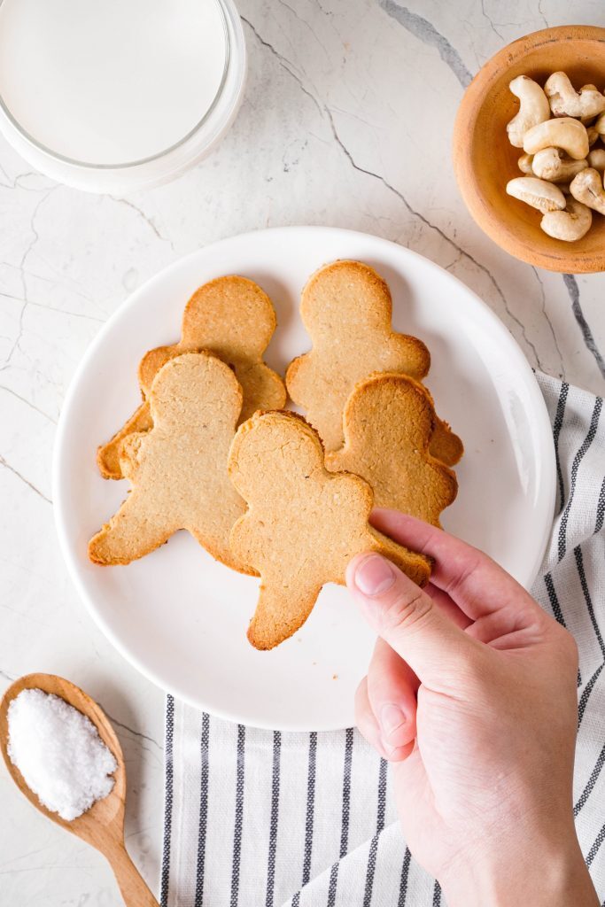 Gluten-Free Sugar Cookies Recipe Kelly Bejelly Gluten free sugar cookies on a plate with flour and cashews to the side