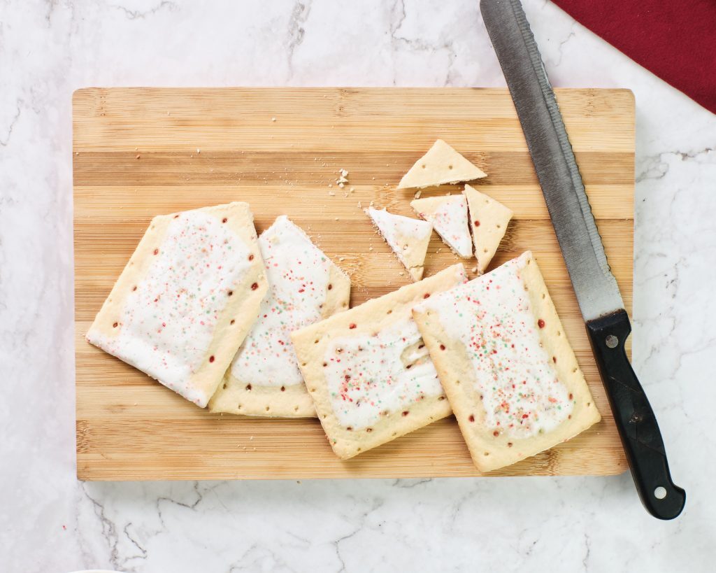Pop-Tart Gingerbread House Kelly Bejelly cut the pop tarts into the house shapes