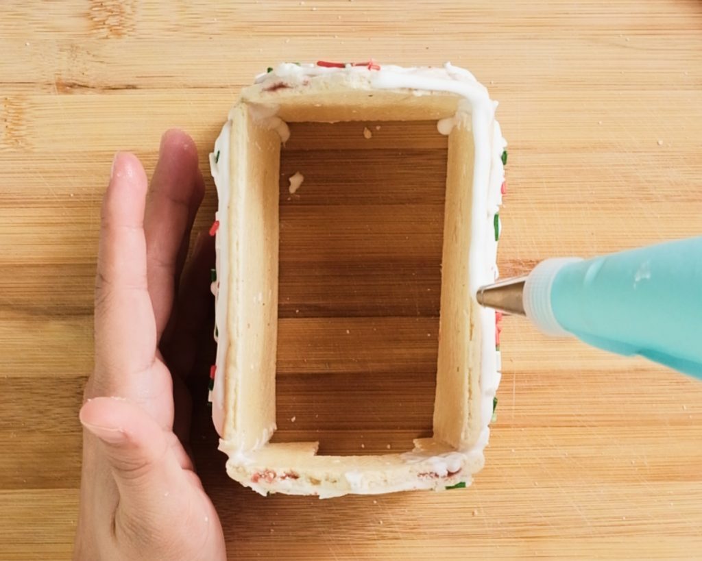 Pop-Tart Gingerbread House Kelly Bejelly Lining walls of pop tart gingerbread house to make the roof