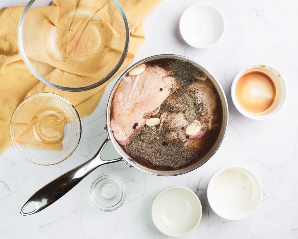 Chicken Adobo Recipe Kelly Bejelly Ingredients in a medium pot with bowls on the side of it