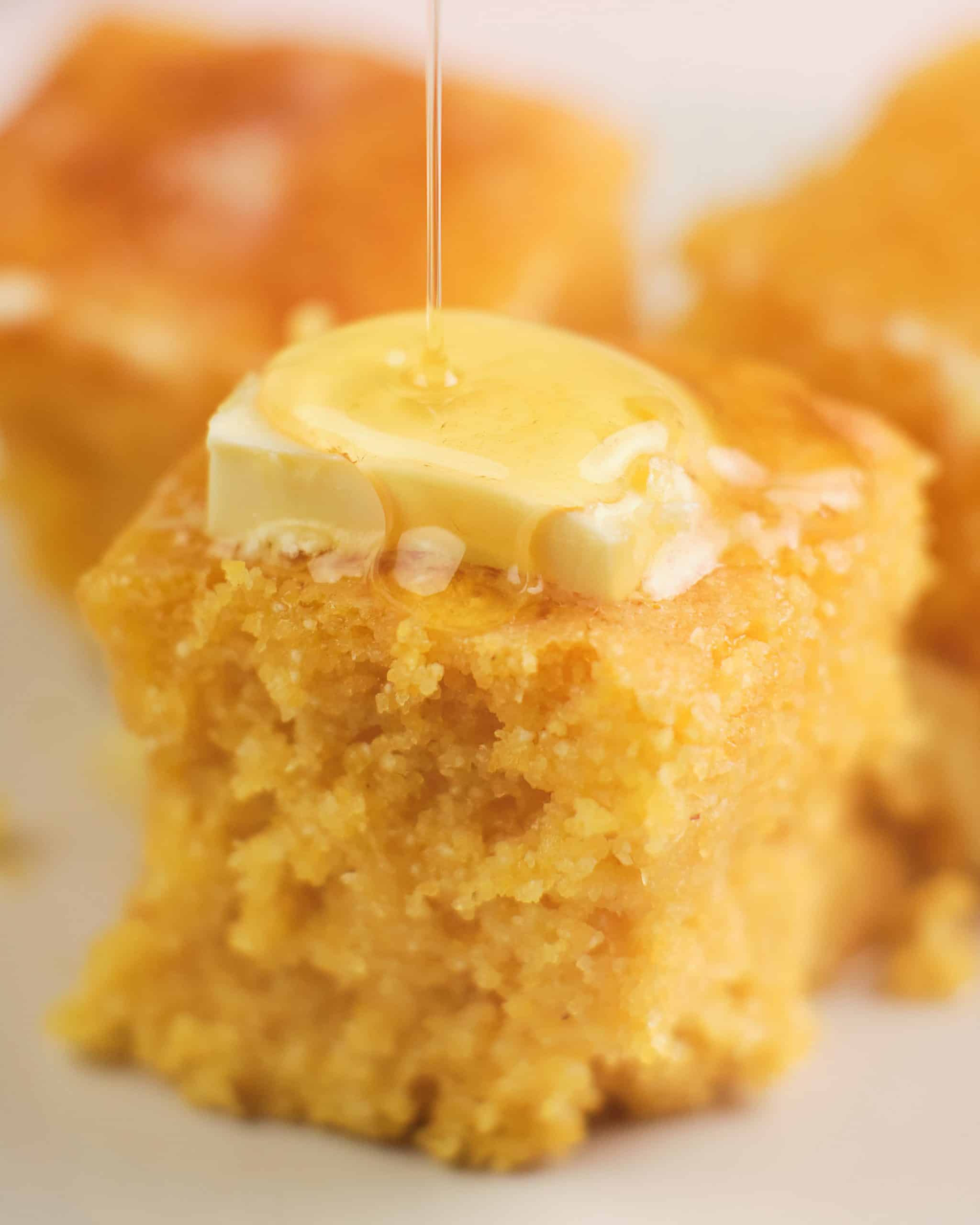 Recipe Index Kelly Bejelly close up of gluten free cornbread with melted butter and honey on top