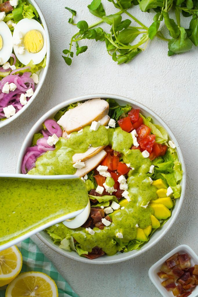 Green Goddess Salad Panera Kelly Bejelly Green Goddess Salad Panera Bread Copycat on table top while covering with salad dressing